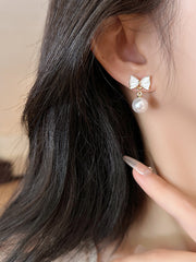 white bow earrings