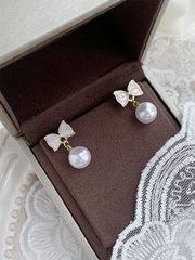 white bow earrings